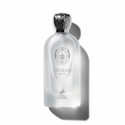 Flat-lay Delilah Blanc perfume with dramatic shadow