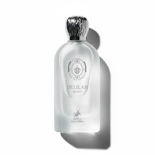 Flat-lay Delilah Blanc perfume with dramatic shadow