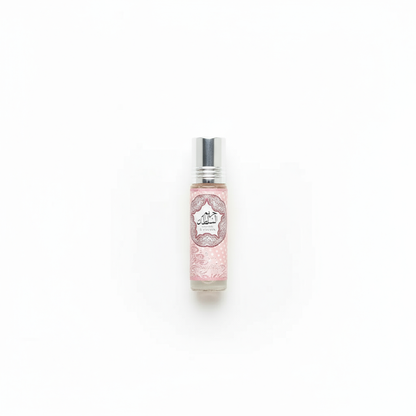 Pink perfume roller bottle on clean background